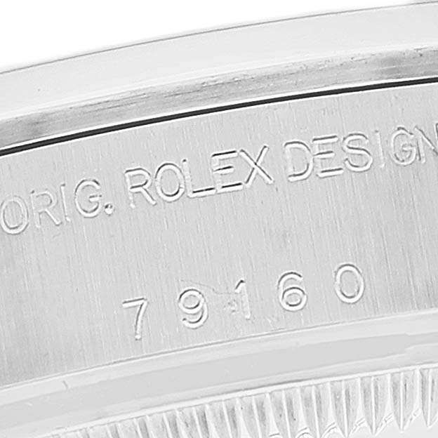 This close-up image of a Rolex Date 79160 Women
s Stainless Steel White Dial 79160 Women
s Stainless Steel White Dial model watch shows the case side engraving with the model number 79160.