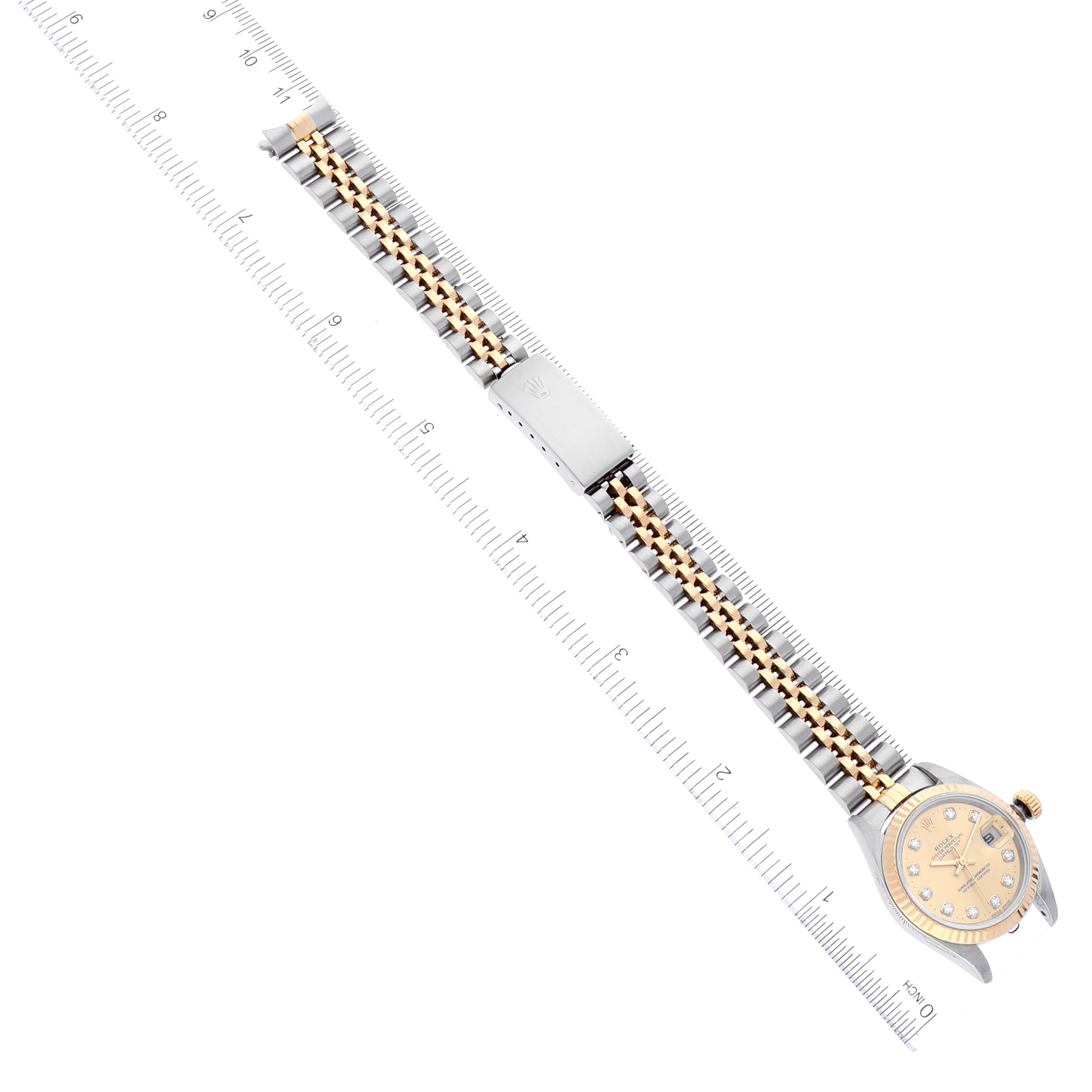 The image shows a Rolex Datejust 69173 Women's Steel and Gold (two tone) Champagne Dial 69173 Women's Steel and Gold (two tone) Champagne Dial watch from a top-down angle, displaying the full length of the band along with the face and clasp.