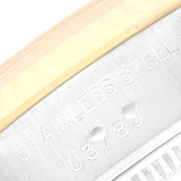 This image shows a close-up of the side of a Rolex Datejust 69173 Women's Steel and Gold (two tone) Champagne Dial 69173 Women's Steel and Gold (two tone) Champagne Dial watch, highlighting part of the case with "STAINLESS STEEL" engraving.