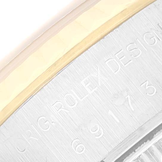 This close-up image shows the engraved bezel and reference number of a Rolex Datejust 69173 Women's Steel and Gold (two tone) Champagne Dial 69173 Women's Steel and Gold (two tone) Champagne Dial watch.