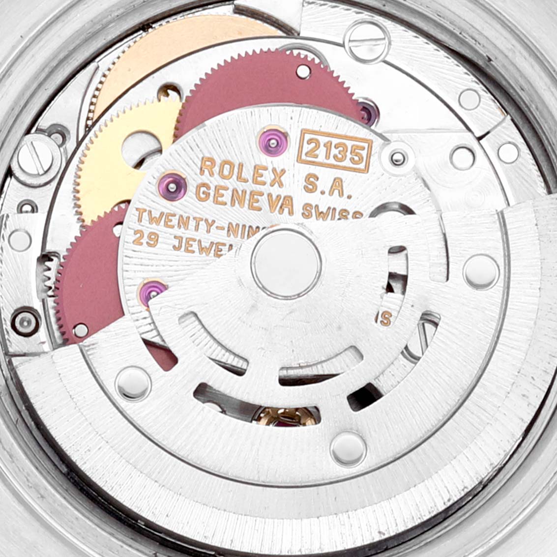 The image shows the internal mechanism of a Rolex Datejust 69173 Women's Steel and Gold (two tone) Champagne Dial 69173 Women's Steel and Gold (two tone) Champagne Dial watch, highlighting gears and the movement with "Rolex S.A. Geneva Swiss" engraved on it.