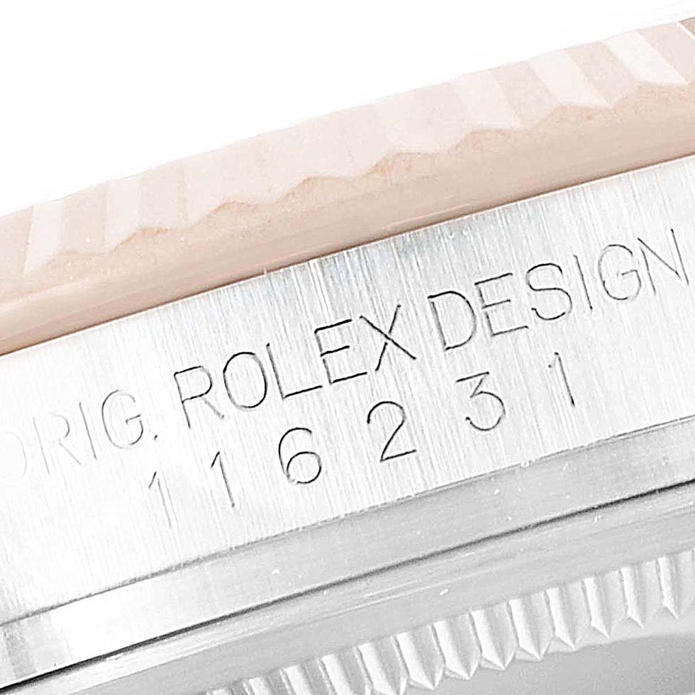 The image displays a close-up of the engraved bezel and case edge of a Rolex Datejust 116231 Men
s Steel and Gold (two tone) Grey Dial 116231 Men
s Steel and Gold (two tone) Grey Dial watch showing its model number.