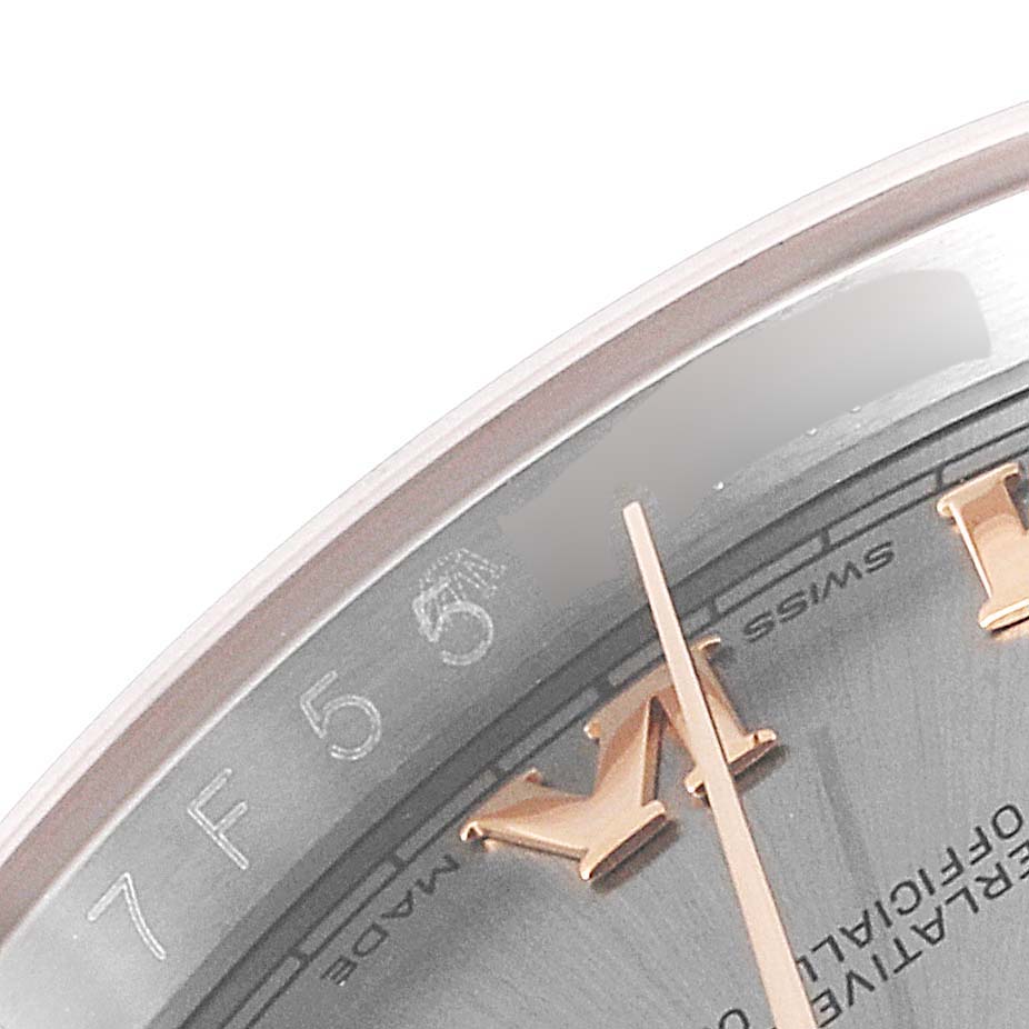 The image shows a close-up of the dial, minute hand, and part of the bezel of a Rolex Datejust 116231 Men
s Steel and Gold (two tone) Grey Dial 116231 Men
s Steel and Gold (two tone) Grey Dial watch.
