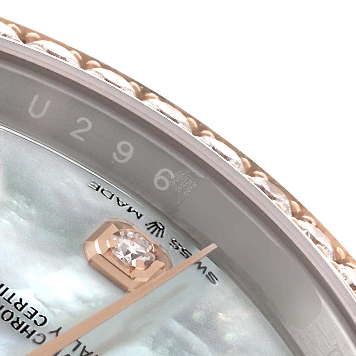 This close-up image shows the bezel, dial, and diamond hour marker of the Rolex Datejust 126281 Men's Steel and Gold (two tone) Mother of Pearl Dial 126281 Men's Steel and Gold (two tone) Mother of Pearl Dial watch.