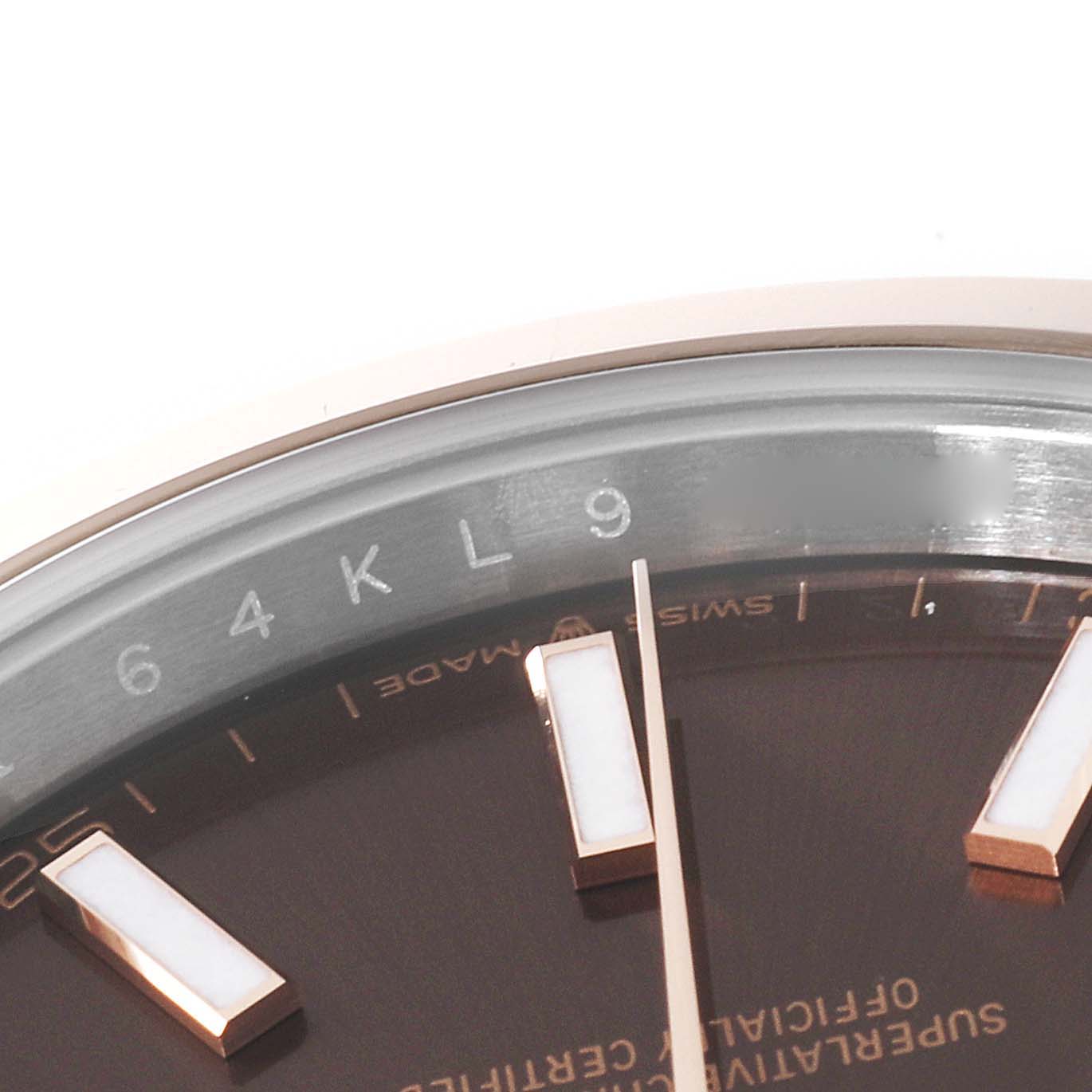 This close-up showcases the dial
s edge, markers, and partial bezel of the Rolex Datejust 41 126301 Men
s Steel and Gold (two tone) Brown Dial 126301 Men
s Steel and Gold (two tone) Brown Dial.