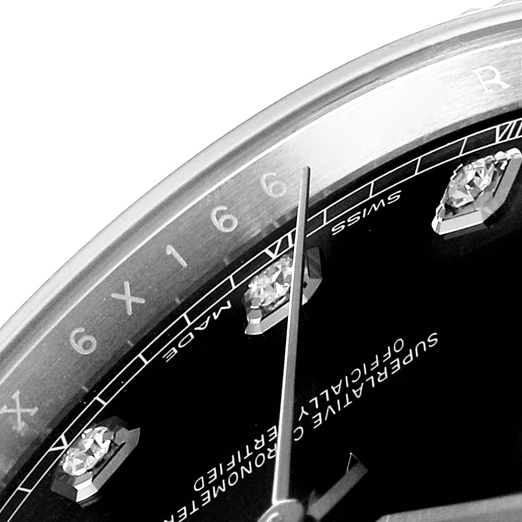 This close-up of the Rolex Datejust 41 126334 Men
s Stainless Steel Black Dial 126334 Men
s Stainless Steel Black Dial watch shows part of the dial with diamond markers and the "Swiss Made" indicators.
