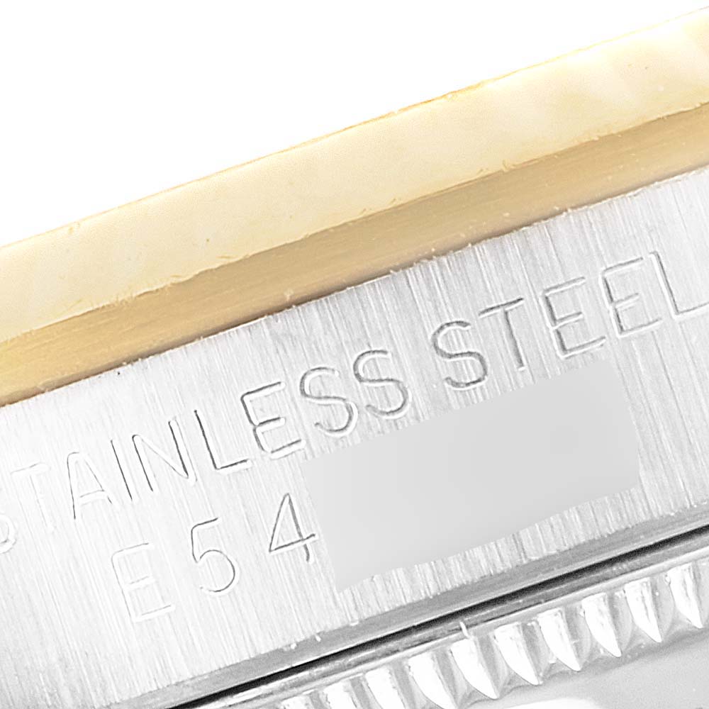 This image shows a close-up of the side of a stainless steel Mid-Size Rolex watch case with engravings.