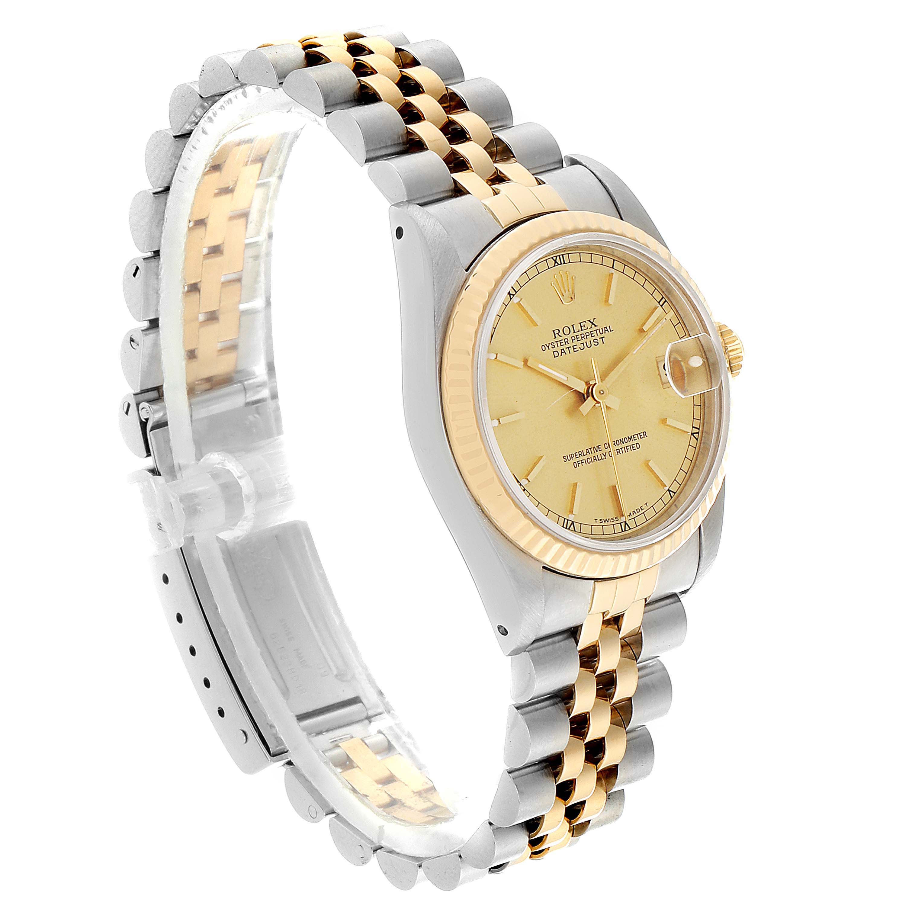 The image shows a Mid-Size Rolex Datejust watch angled to display the face, bezel, and two-tone bracelet.