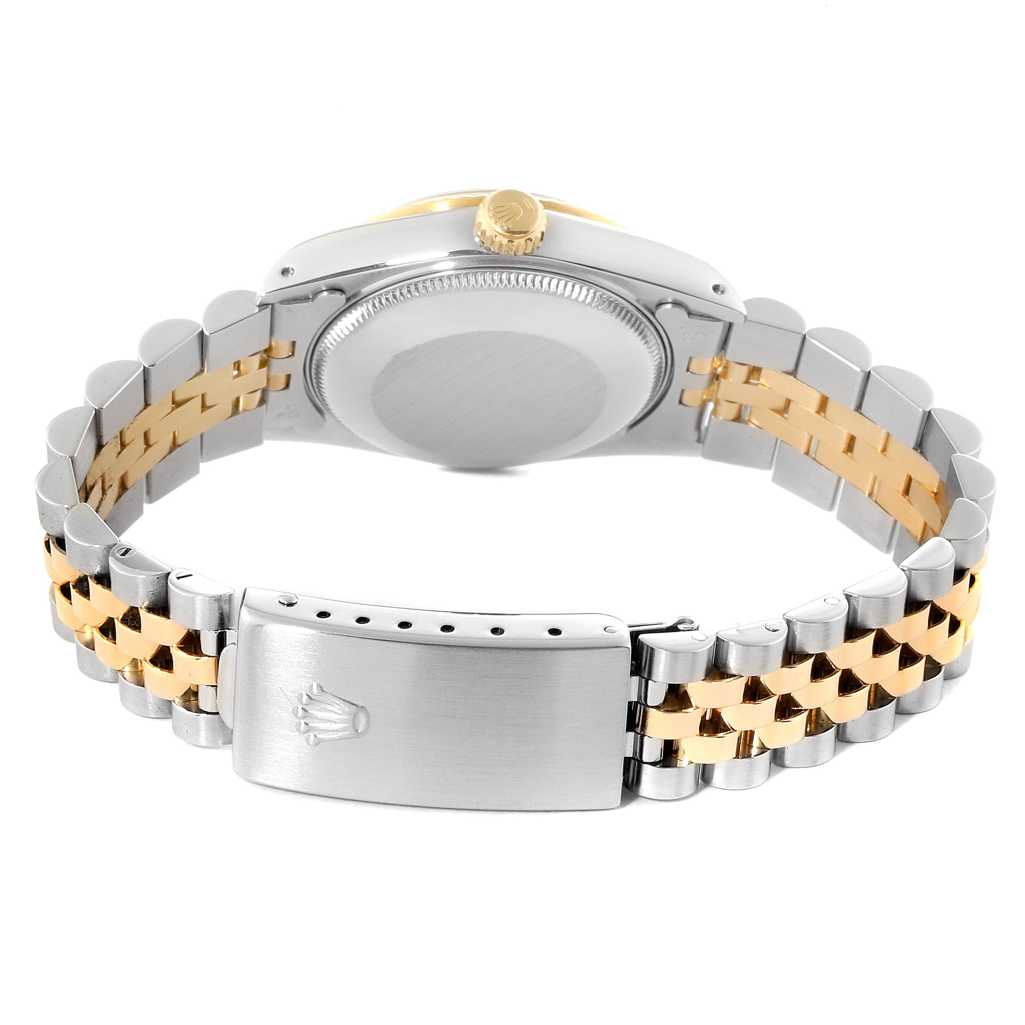 The image shows the back side of the Mid-Size Rolex watch, featuring its case back and jubilee bracelet with a clasp.