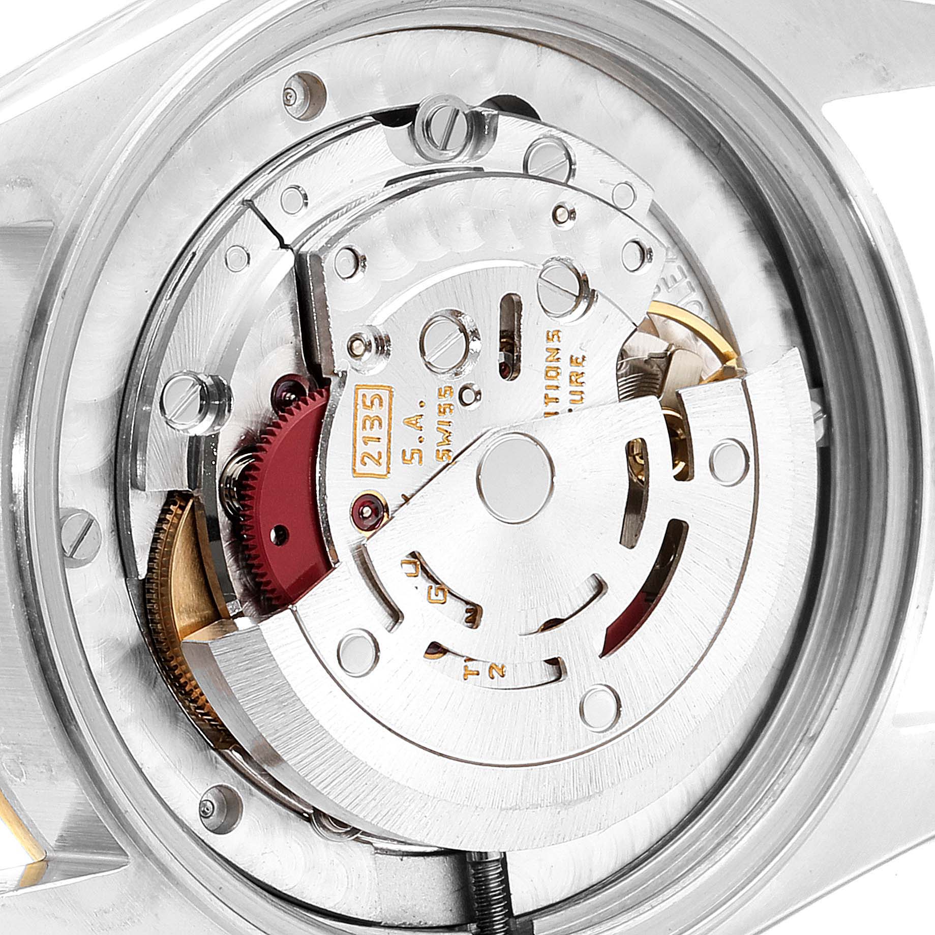 This image shows the intricate inner mechanism of a Rolex Mid-Size 68273 Women's Steel and Gold (two tone) Champagne Dial 68273 Women's Steel and Gold (two tone) Champagne Dial watch from a top-down angle.