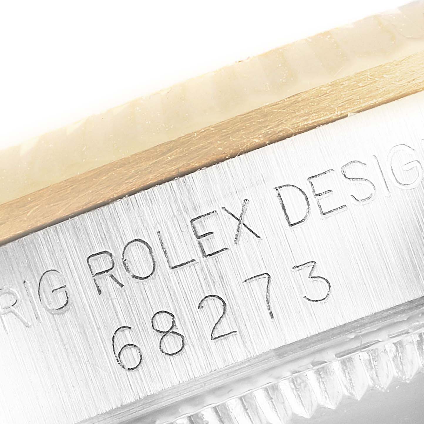 The image shows a close-up of the side of a Mid-Size Rolex model, featuring the engraved model number 68273.