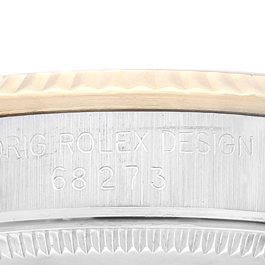 This image shows a close-up of the case side and bezel of a Mid-Size Rolex watch, featuring the model number and the words "ORIG ROLEX DESIGN."