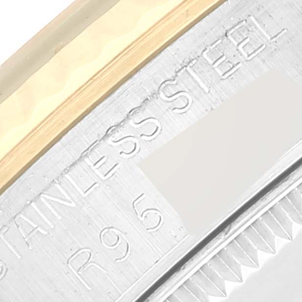 The image shows a close-up of the bezel and part of the case back engraving on a Rolex Mid-Size 68273 Women's Steel and Gold (two tone) Champagne Dial 68273 Women's Steel and Gold (two tone) Champagne Dial model watch.