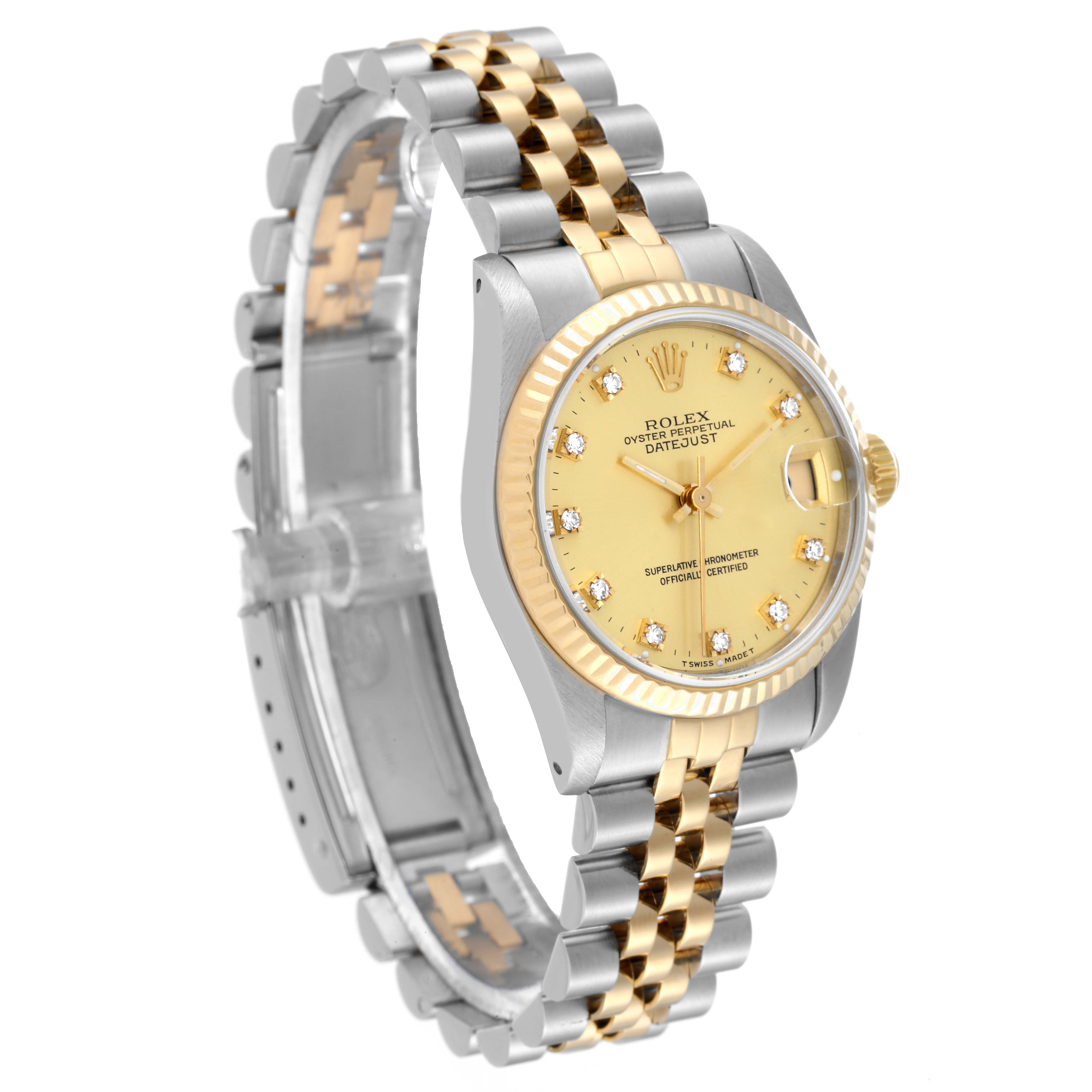 The image shows a side angle of the Rolex Mid-Size 68273 Women's Steel and Gold (two tone) Champagne Dial 68273 Women's Steel and Gold (two tone) Champagne Dial model, highlighting the gold dial, bi-metallic bracelet, and fluted bezel.