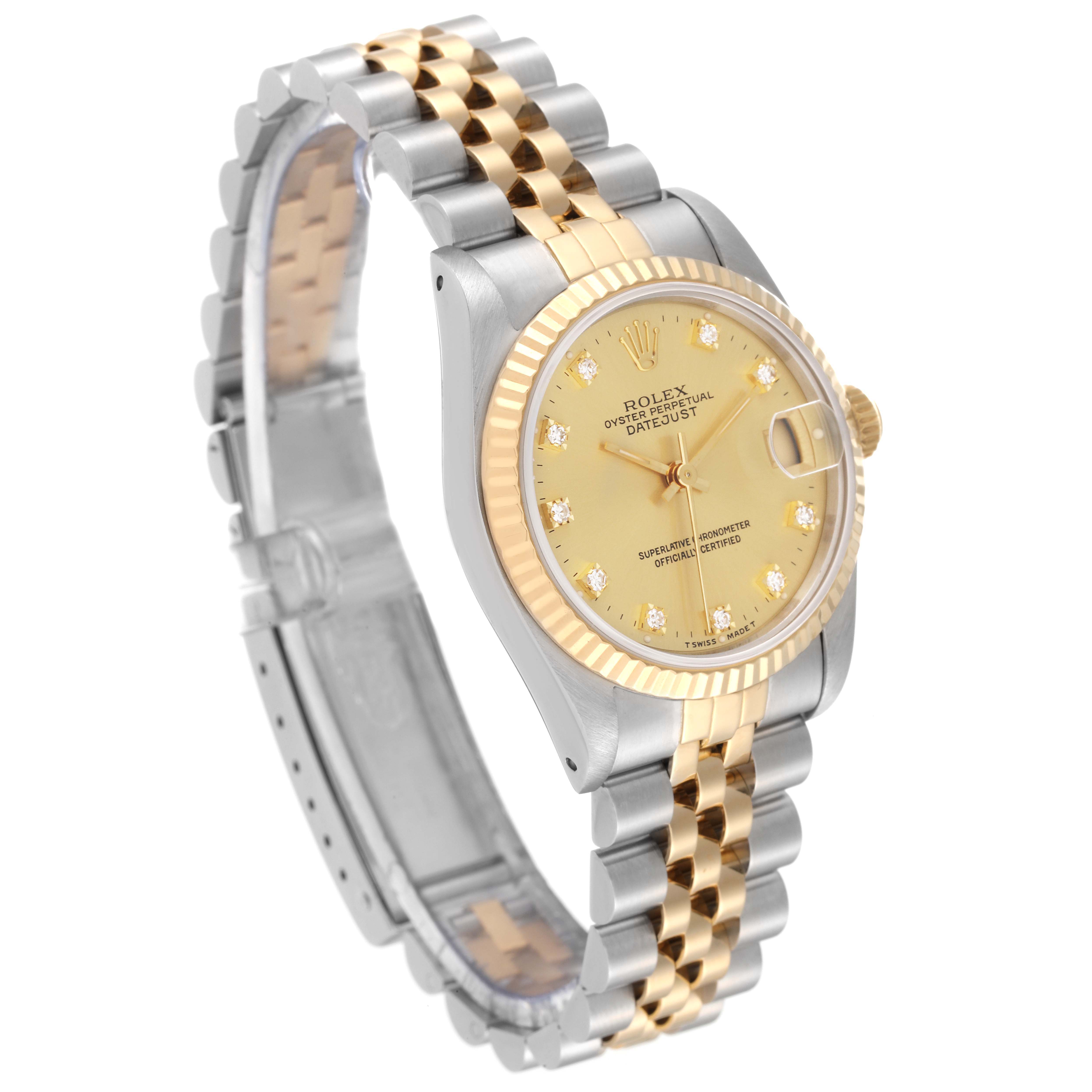 The image shows a side angle of a Rolex Mid-Size 68273 Women's Steel and Gold (two tone) Champagne Dial 68273 Women's Steel and Gold (two tone) Champagne Dial model, displaying the watch face, gold bezel, and two-tone bracelet.