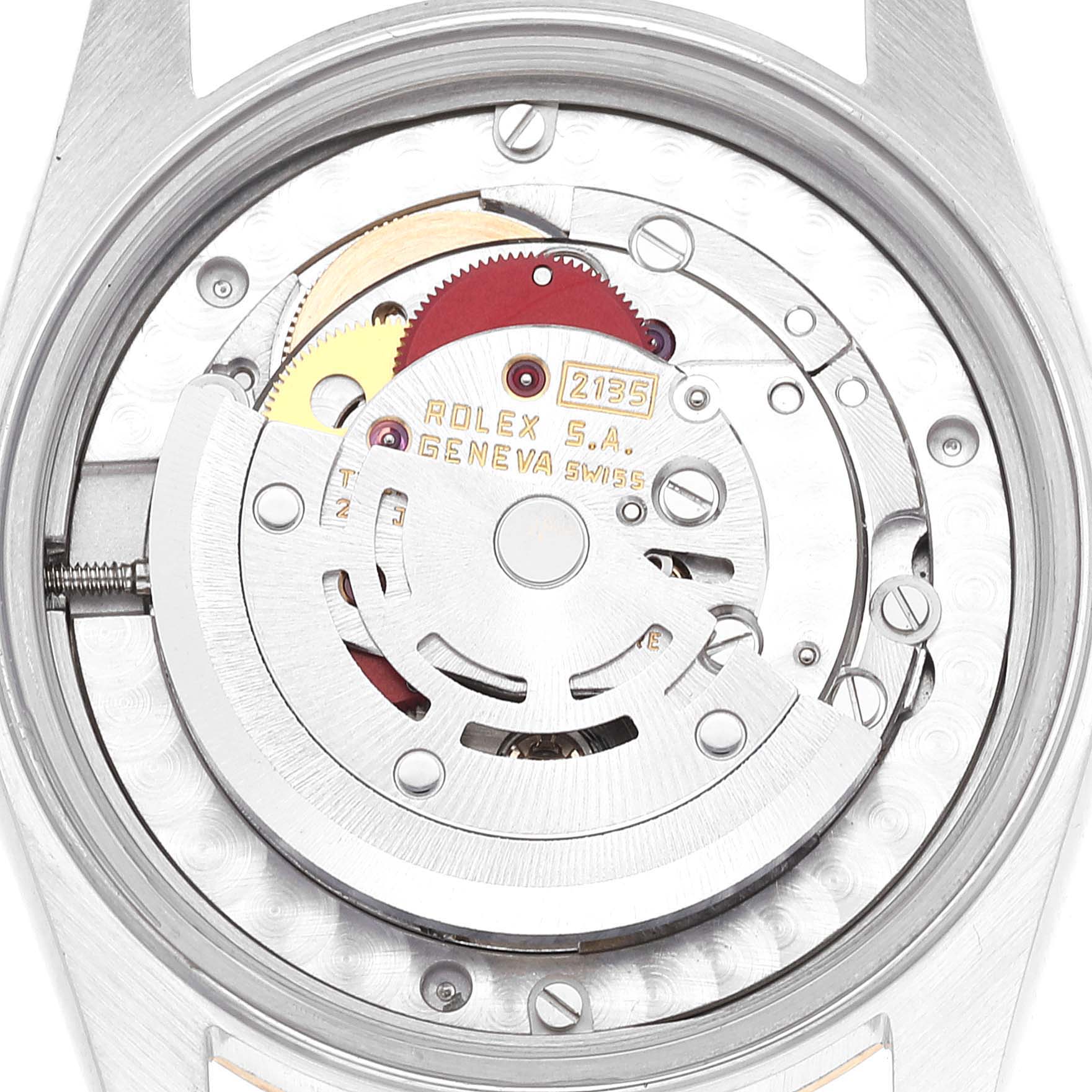 The image shows the internal movement mechanism of a Mid-Size Rolex watch viewed from the back.
