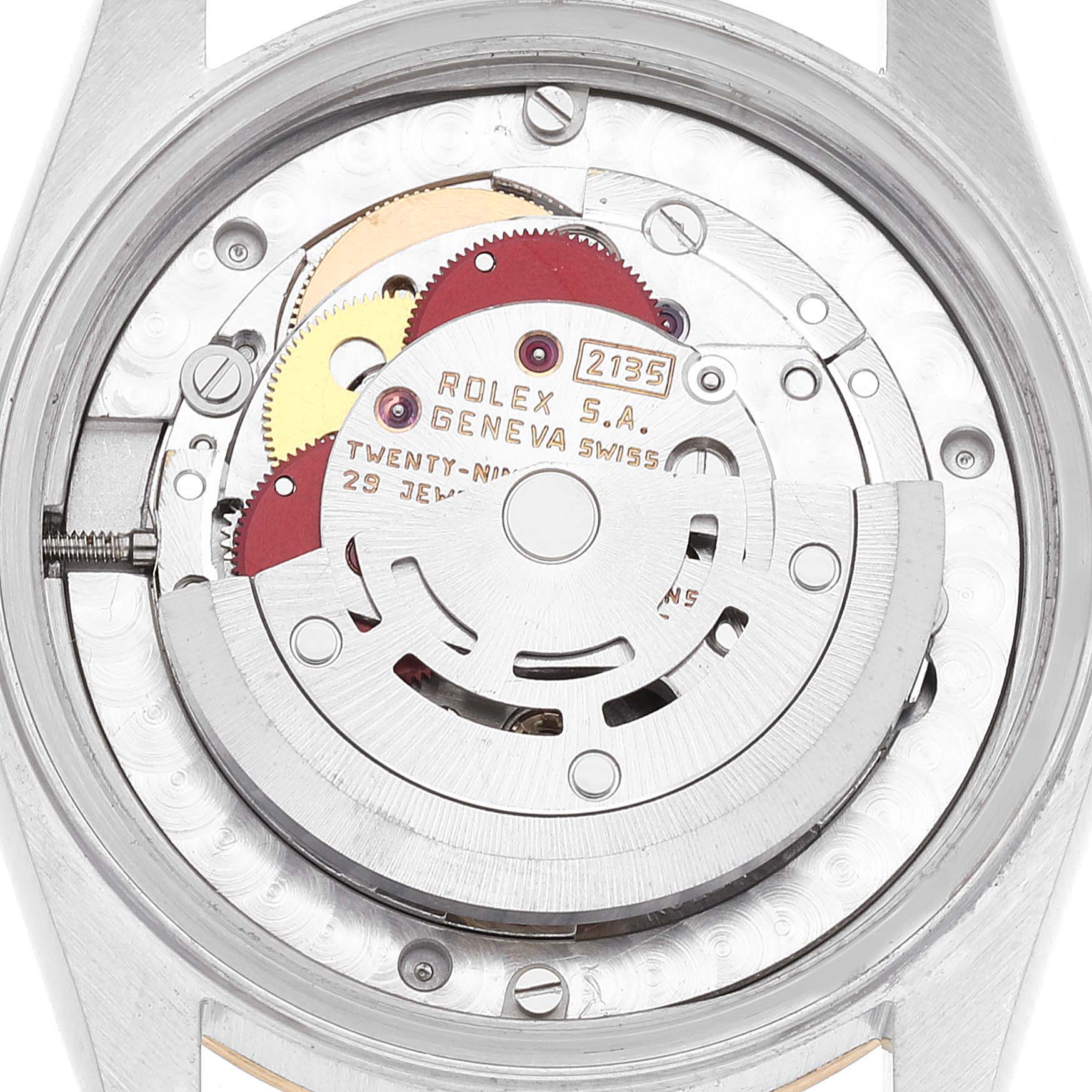 The image shows the internal mechanism of a Rolex Mid-Size 68273 Women's Steel and Gold (two tone) Champagne Dial 68273 Women's Steel and Gold (two tone) Champagne Dial model watch from a rear angle, revealing the movement and gears.