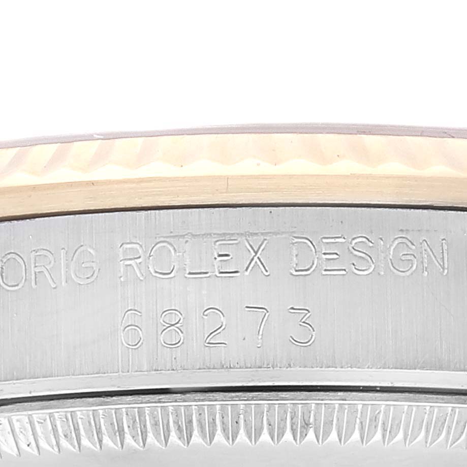 The image shows a close-up of the engraved side bezel of a Mid-Size Rolex watch with the model number 68273.