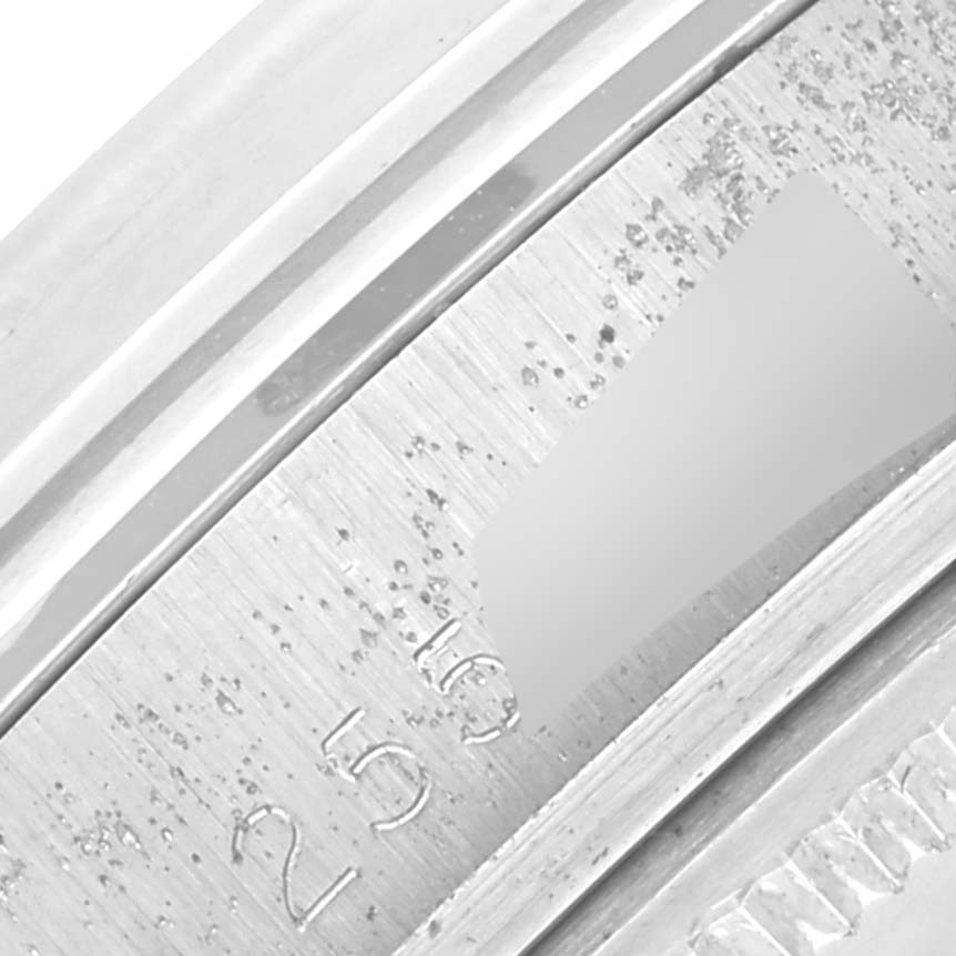 The image shows a close-up of the edge of the bezel with engraved markings from the Rolex Vintage Collection 1600 Men's Stainless Steel Silver Dial 1600 Men's Stainless Steel Silver Dial.