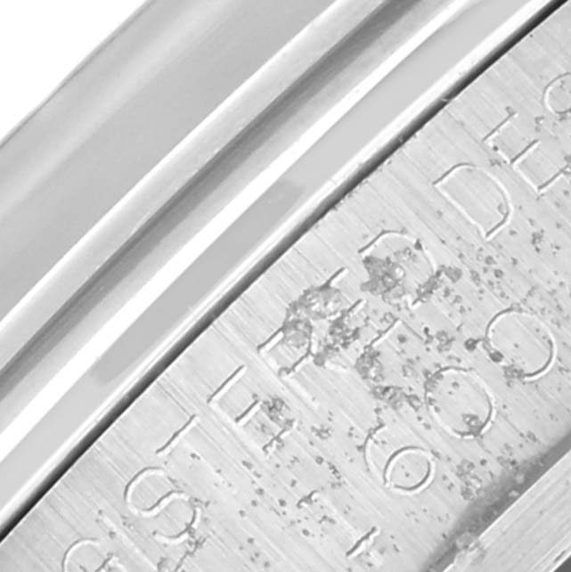 The image shows a close-up of the engraved details on the side of the Rolex Vintage Collection 1600 Men's Stainless Steel Silver Dial 1600 Men's Stainless Steel Silver Dial watch.