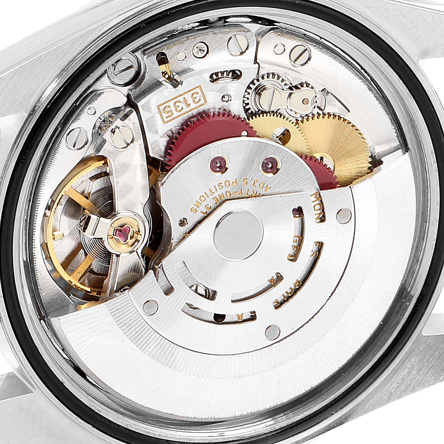 The image shows the movement mechanism of a Rolex Datejust 16233G Men's Steel and Gold (two tone) Silver Dial 16233G Men's Steel and Gold (two tone) Silver Dial watch from a back angle, highlighting gears and intricate components.