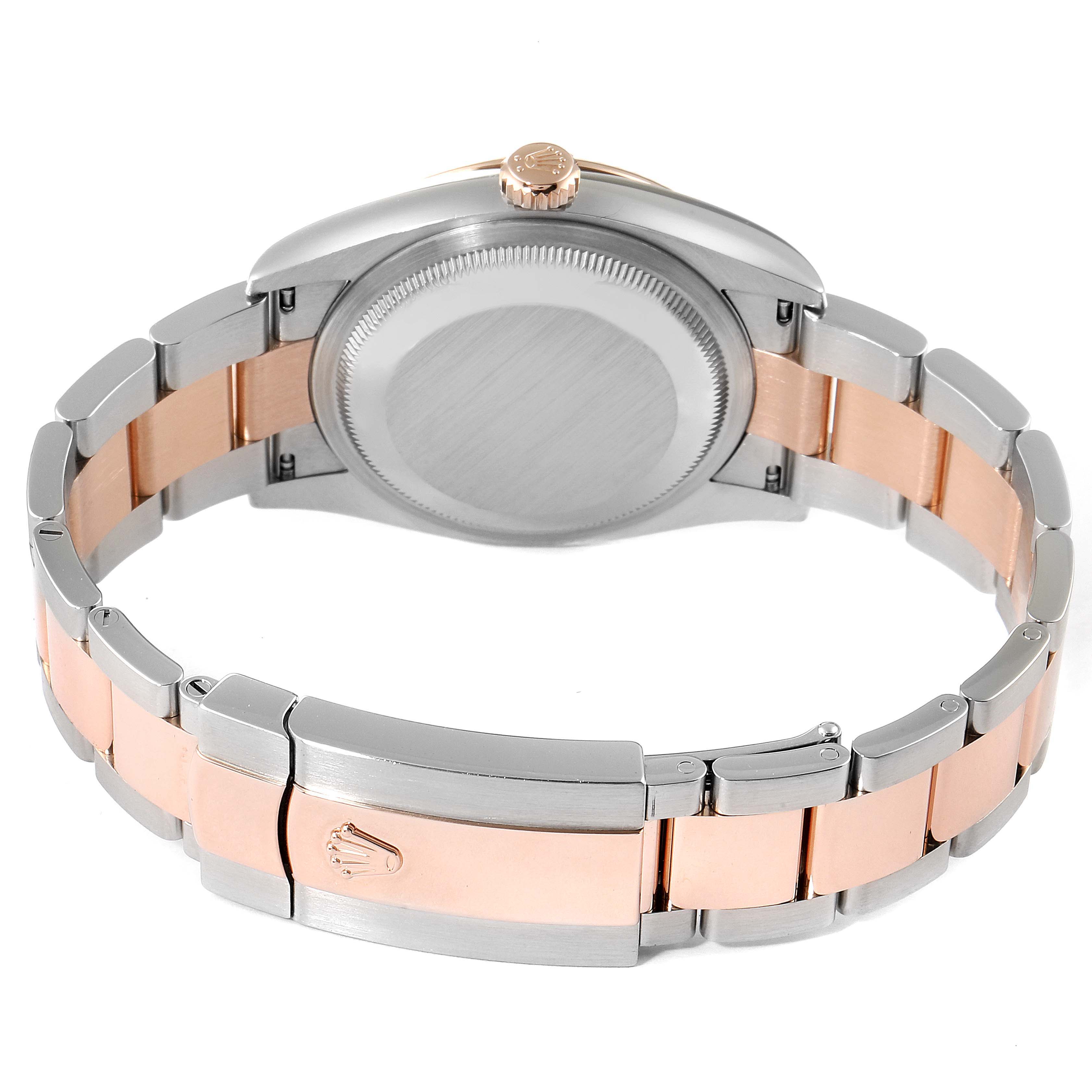 The image shows the back case and bracelet of a Rolex Datejust 126231 Men's Steel and Gold (two tone) Mother of Pearl Dial 126231 Men's Steel and Gold (two tone) Mother of Pearl Dial watch, featuring a two-tone design with silver and rose gold links.