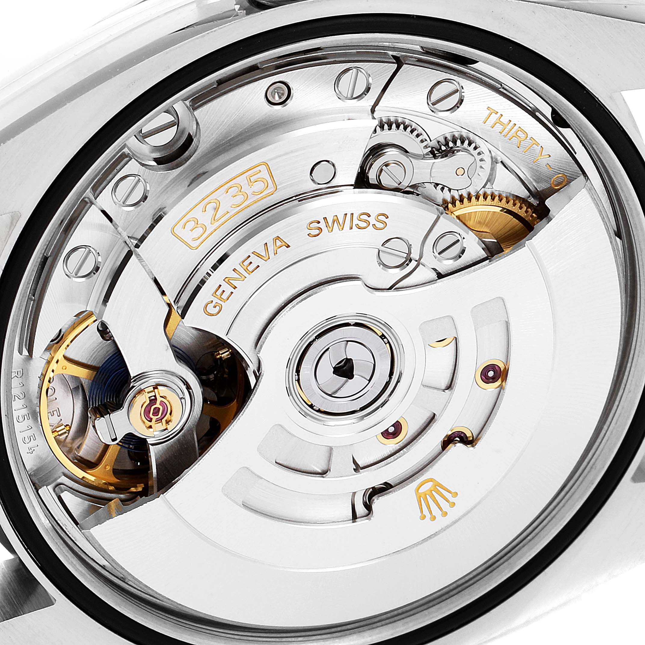 The image shows the movement mechanism of a Rolex Datejust 126231 Men's Steel and Gold (two tone) Mother of Pearl Dial 126231 Men's Steel and Gold (two tone) Mother of Pearl Dial, highlighting gears and the "3235" marking.