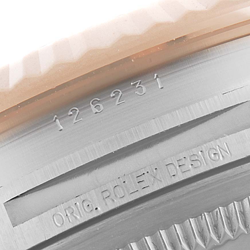 This image shows a close-up of the model number and design text on the case of a Rolex Datejust 126231 Men's Steel and Gold (two tone) Mother of Pearl Dial 126231 Men's Steel and Gold (two tone) Mother of Pearl Dial watch.
