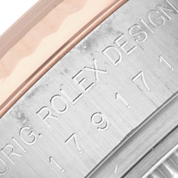 The image shows a close-up of the Rolex Datejust 179171 Women's Steel and Gold (two tone) Black Dial 179171 Women's Steel and Gold (two tone) Black Dial's engraved inner bezel with "ORIG ROLEX DESIGN."