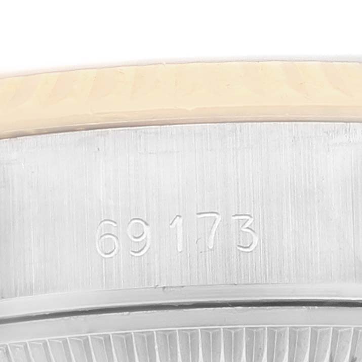 This image shows a close-up of the side of a Rolex Datejust 69173 Women's Steel and Gold (two tone) Champagne Dial 69173 Women's Steel and Gold (two tone) Champagne Dial watch case with the model number 69173 engraved.