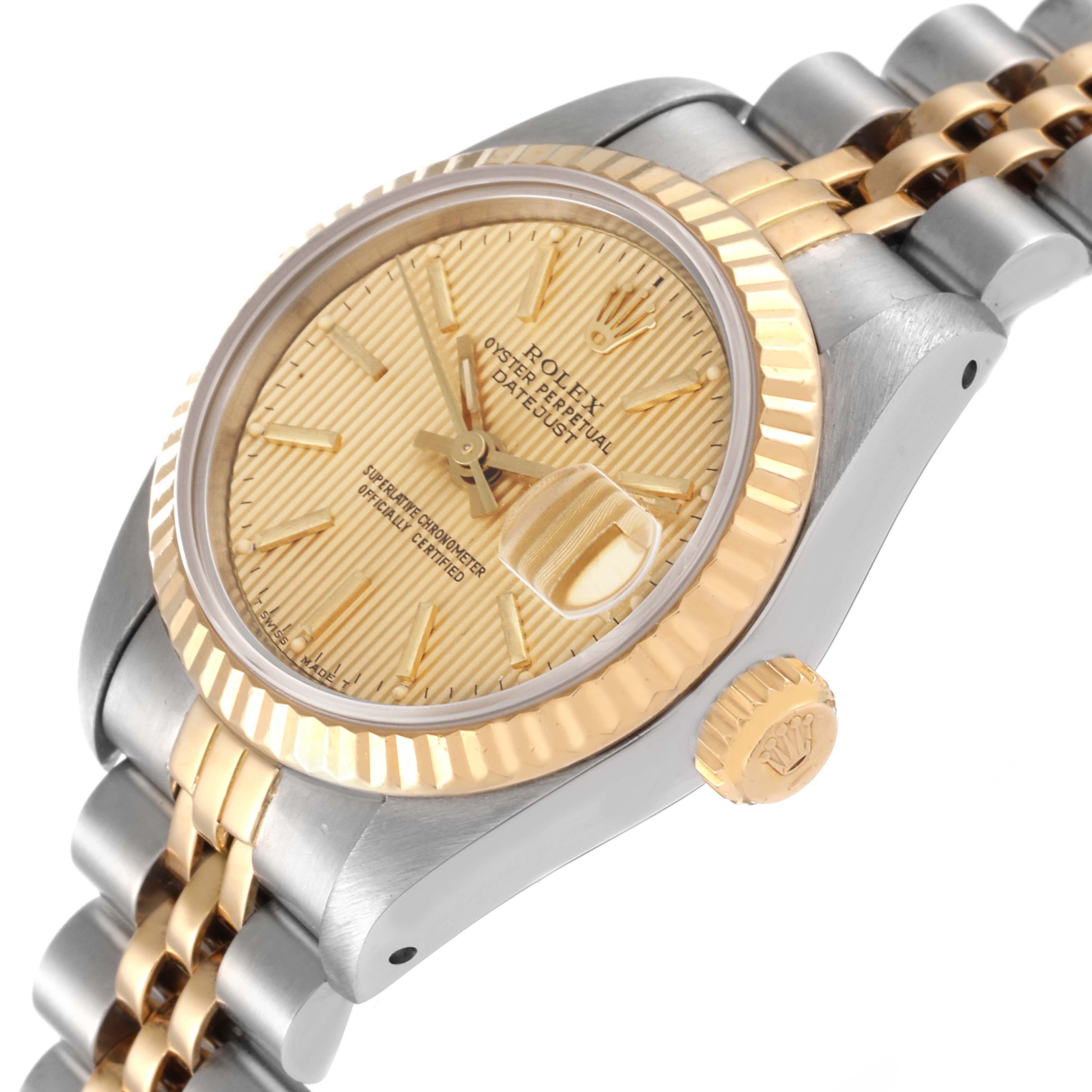 The image shows a Rolex Datejust 69173 Women's Steel and Gold (two tone) Champagne Dial 69173 Women's Steel and Gold (two tone) Champagne Dial watch from an angled side view, highlighting the dial, bezel, crown, and part of the bracelet.