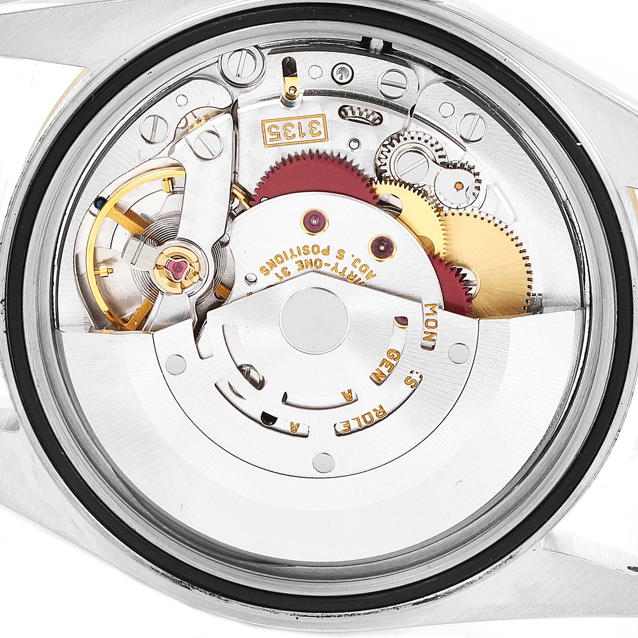 This image shows an internal view of the Rolex Datejust 16233 Men's Steel and Gold (two tone) Silver Dial 16233 Men's Steel and Gold (two tone) Silver Dial watch movement, highlighting gears and mechanical components.