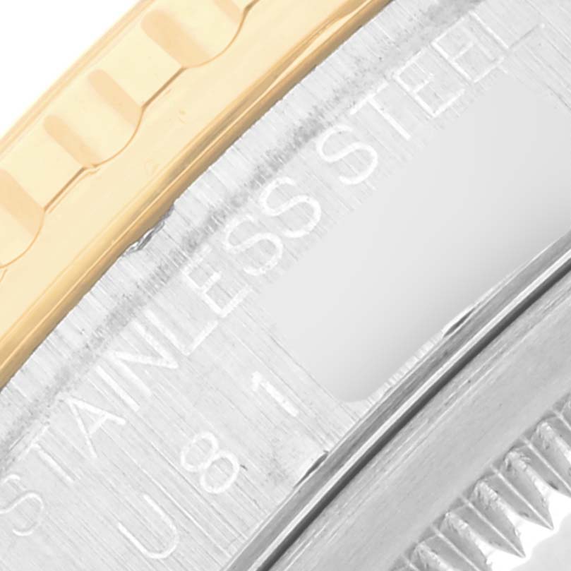 The image shows a close-up of the side case and bezel area of a Rolex Datejust 16263 Men
s Steel and Gold (two tone) Champagne Dial 16263 Men
s Steel and Gold (two tone) Champagne Dial watch, highlighting the stainless steel and gold details.