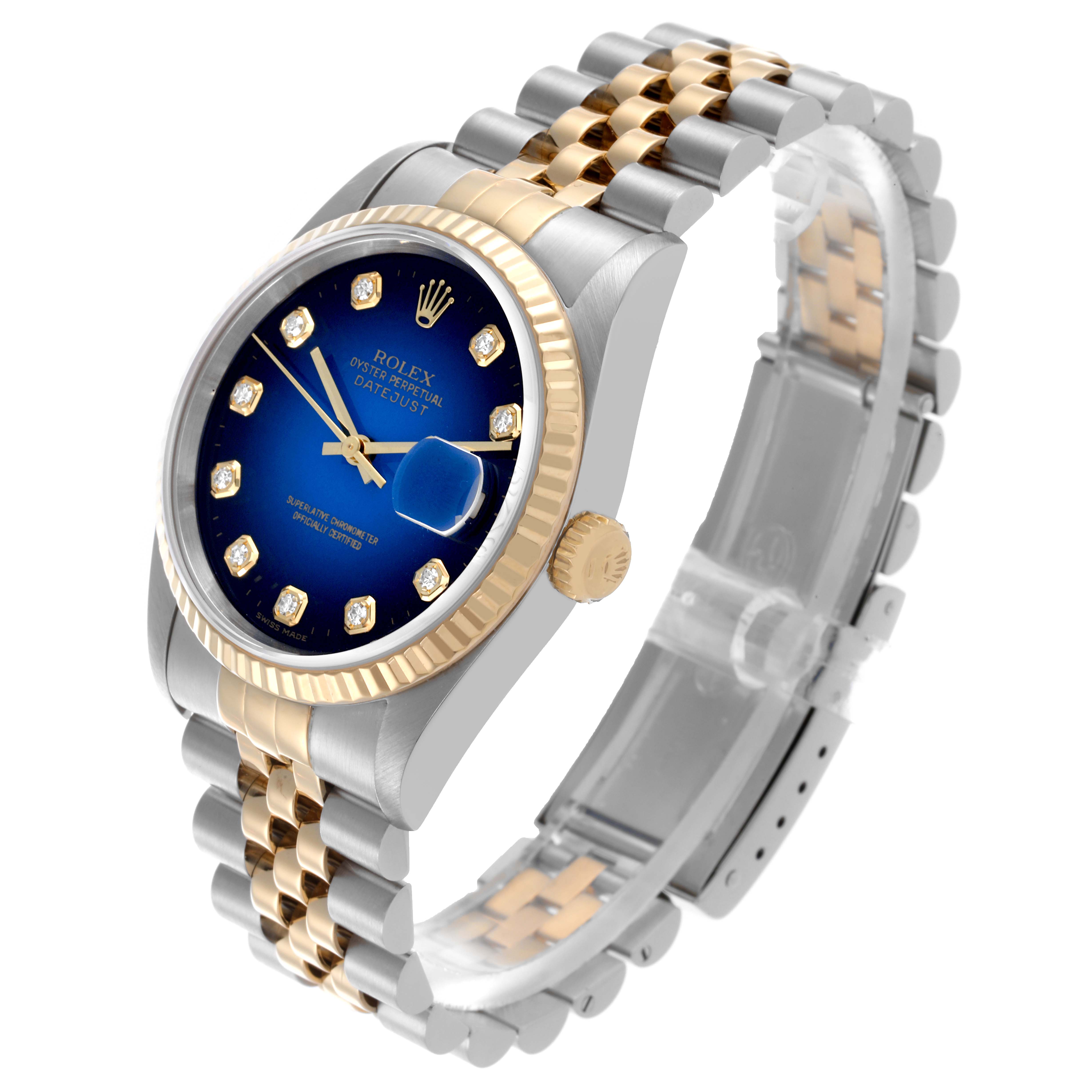 The Rolex Datejust 16233 Men's Steel and Gold (two tone) Blue Dial 16233 Men's Steel and Gold (two tone) Blue Dial watch is shown at a three-quarter angle highlighting the blue dial, fluted bezel, and Jubilee bracelet.