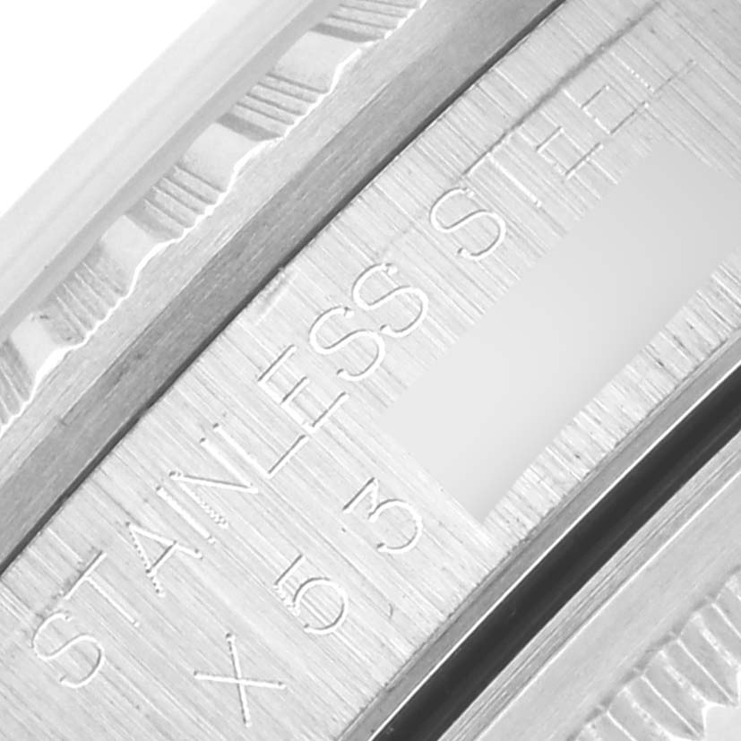 This image shows a close-up of the stainless steel engraving on a Rolex Datejust 16220 Men
s Stainless Steel White Dial 16220 Men
s Stainless Steel White Dial watch case.