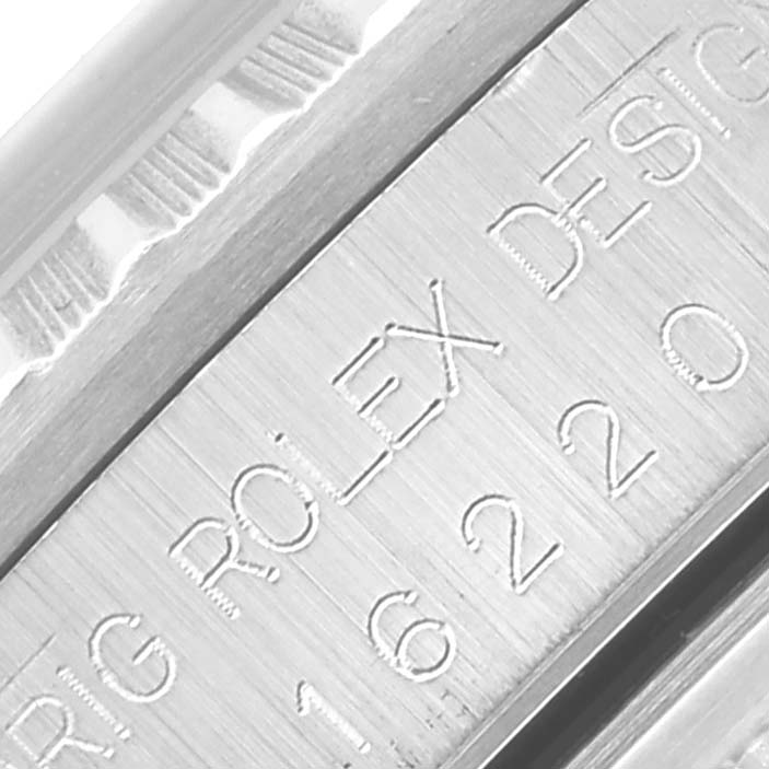 The image shows a close-up of the engraved inner bezel of a Rolex Datejust 16220 Men
s Stainless Steel White Dial 16220 Men
s Stainless Steel White Dial watch.