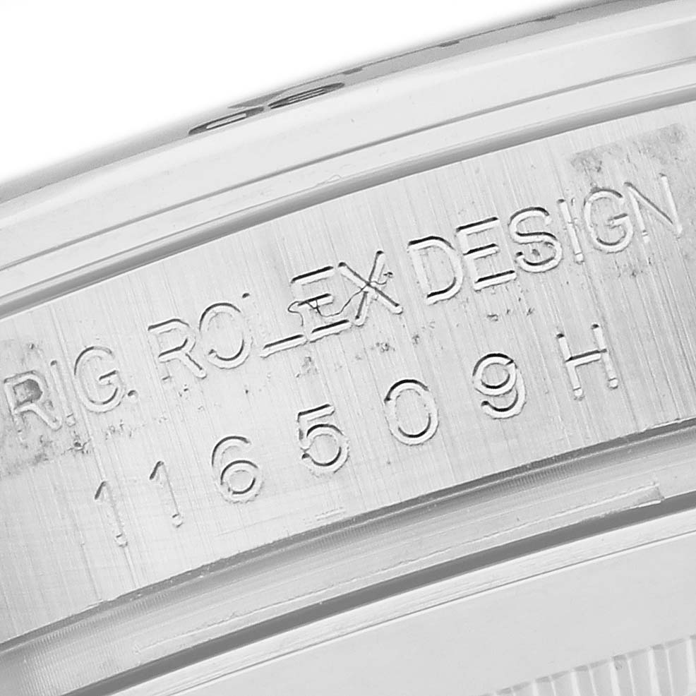 The image shows the engraved side of a Rolex Daytona 116509 Men's White Gold Blue Dial 116509 Men's White Gold Blue Dial, focusing on the model and serial number.