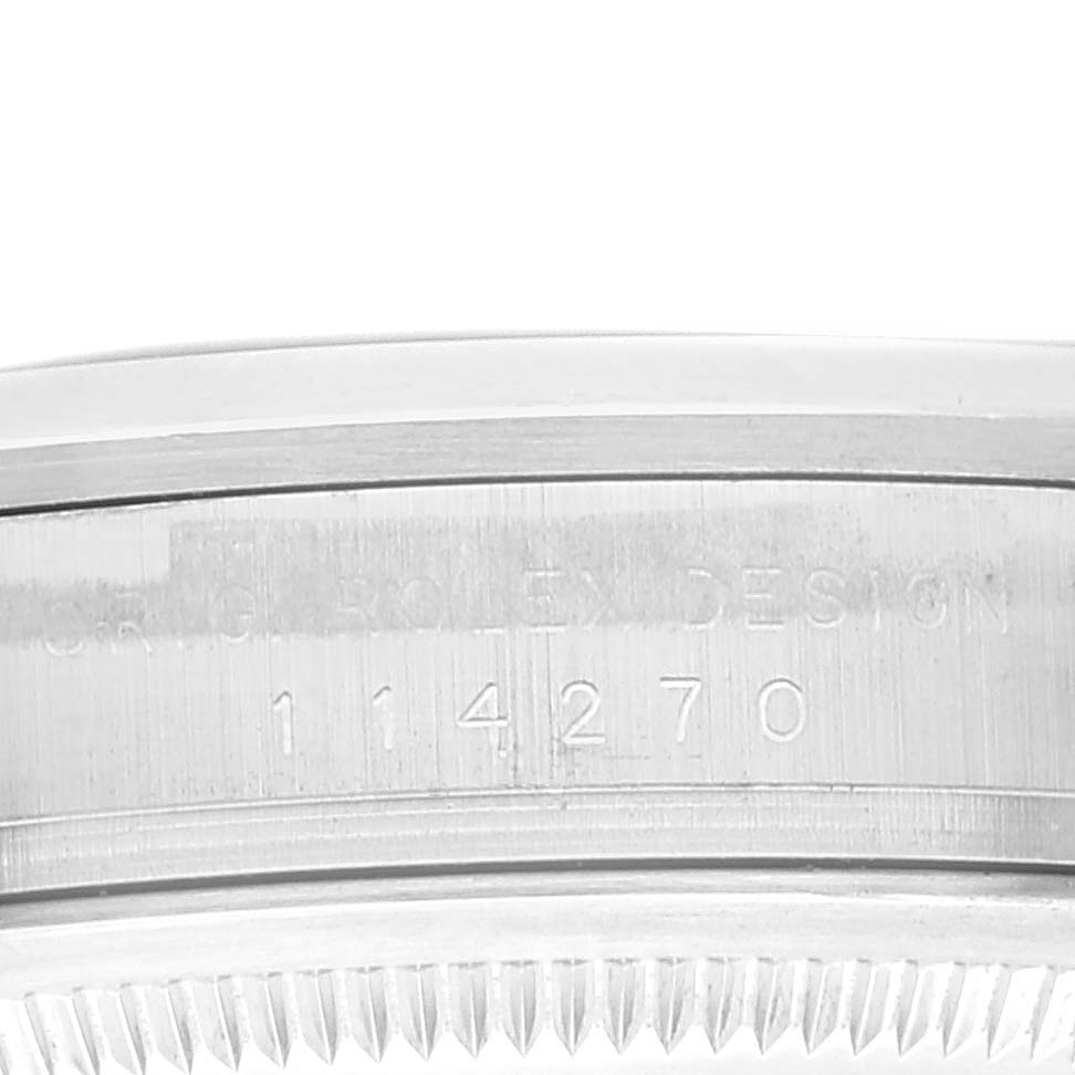 This image shows a close-up of the case side and reference number engraving on a Rolex Explorer 114270 Men
s Stainless Steel Black Dial 114270 Men
s Stainless Steel Black Dial watch.