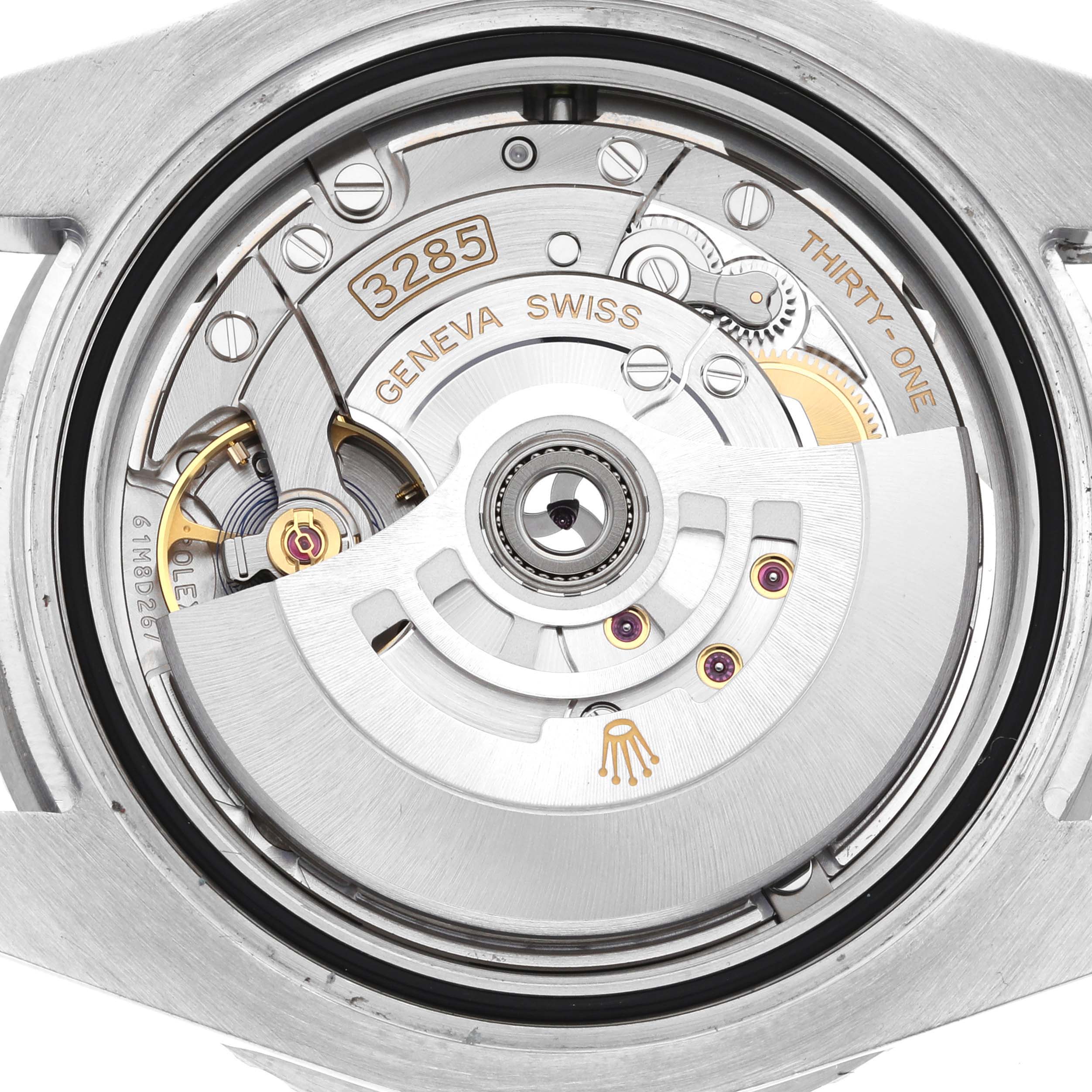 The image shows a close-up of the movement inside a Rolex GMT-Master 126720 Men's Stainless Steel Black Dial 126720 Men's Stainless Steel Black Dial watch, highlighting the rotor and intricate mechanics.