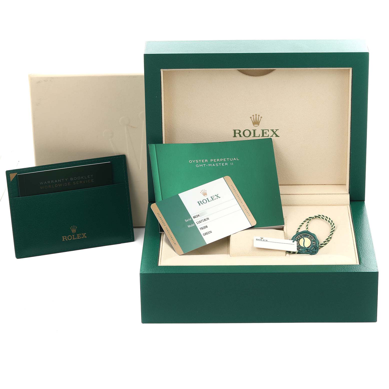 The image shows a Rolex GMT-Master 116718 Men's Yellow Gold Green Dial 116718 Men's Yellow Gold Green Dial II box, warranty cards, and tags at a frontal angle.