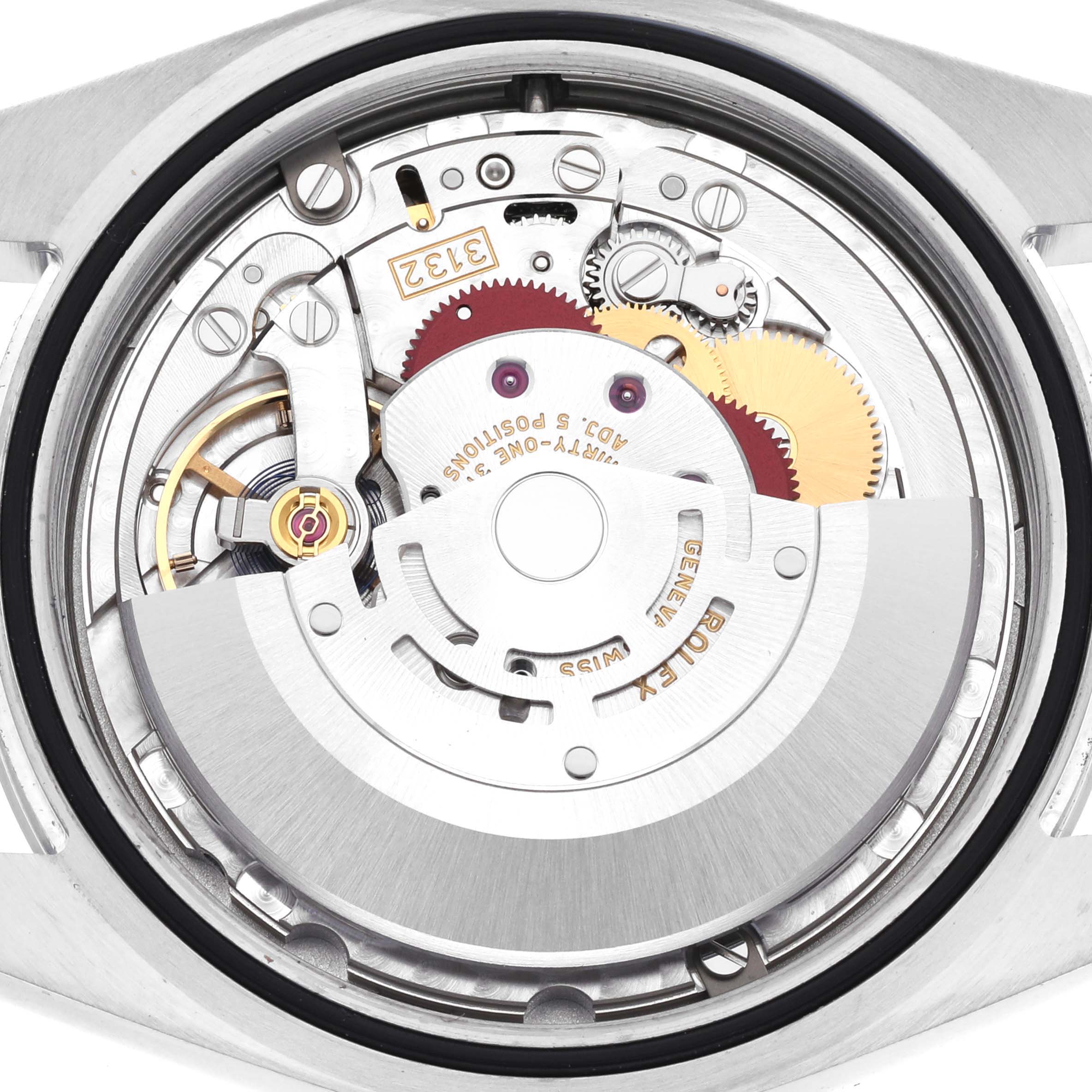 The image shows the internal mechanism of a Rolex Oyster Perpetual 114300 Men's Stainless Steel Blue Dial 114300 Men's Stainless Steel Blue Dial watch, highlighting gears and rotor from a back angle.