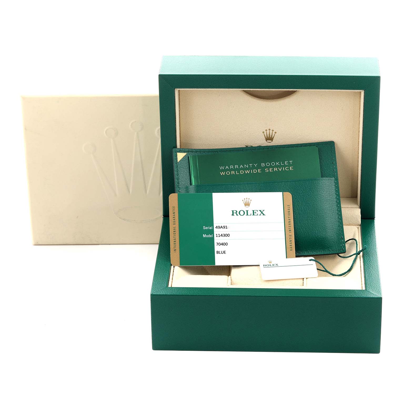 The image shows a Rolex Oyster Perpetual 114300 Men's Stainless Steel Blue Dial 114300 Men's Stainless Steel Blue Dial watch box, warranty booklet, and model card.