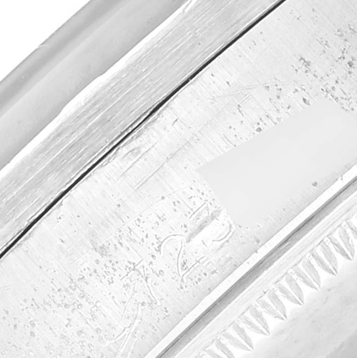 This close-up angle shows the detailed engraving and edge of the bezel of the Rolex Vintage Collection 1007 Men's Stainless Steel Silver Dial 1007 Men's Stainless Steel Silver Dial watch.