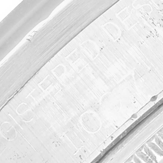 This image shows a close-up of the engraved bezel on the case of a Rolex Vintage Collection 1007 Men's Stainless Steel Silver Dial 1007 Men's Stainless Steel Silver Dial model.