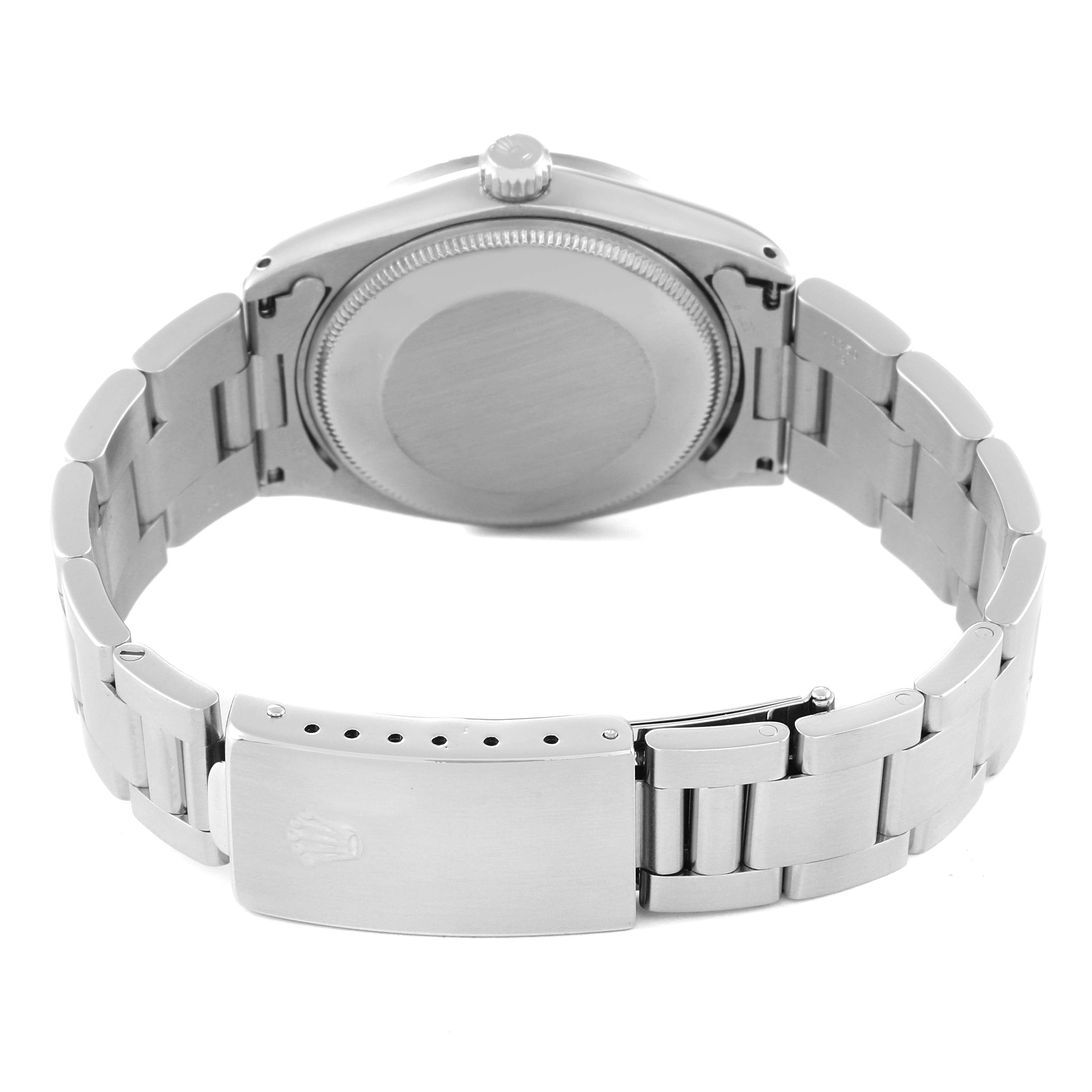 This image shows the backside and clasp of the Vintage Collection Rolex watch, displaying the case back and bracelet.