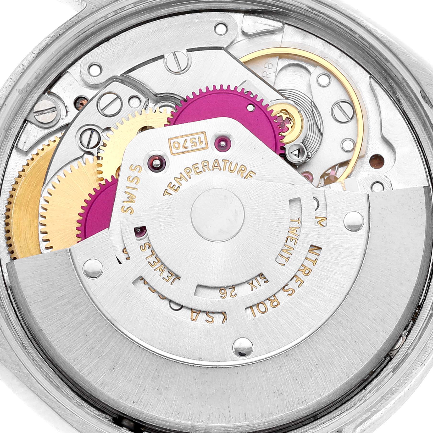The image shows a close-up of the movement mechanism of the Rolex Vintage Collection 1007 Men's Stainless Steel Silver Dial 1007 Men's Stainless Steel Silver Dial model, highlighting the gears and internal parts.