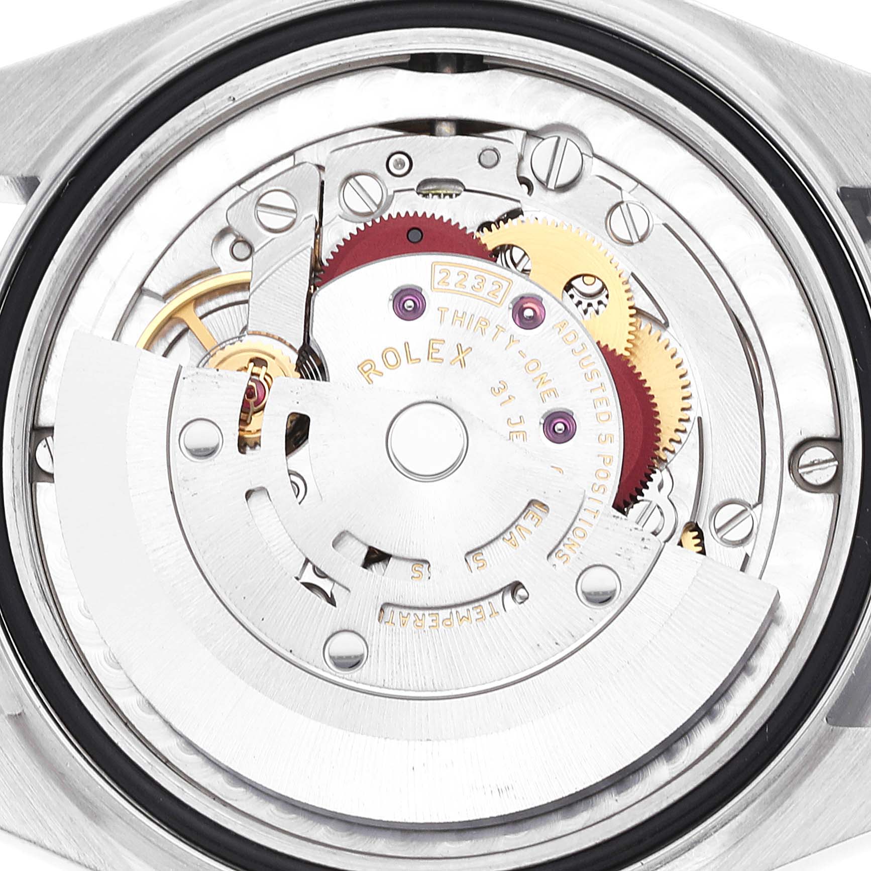 The image shows the internal mechanism of a mid-size Rolex watch at a top-down angle.