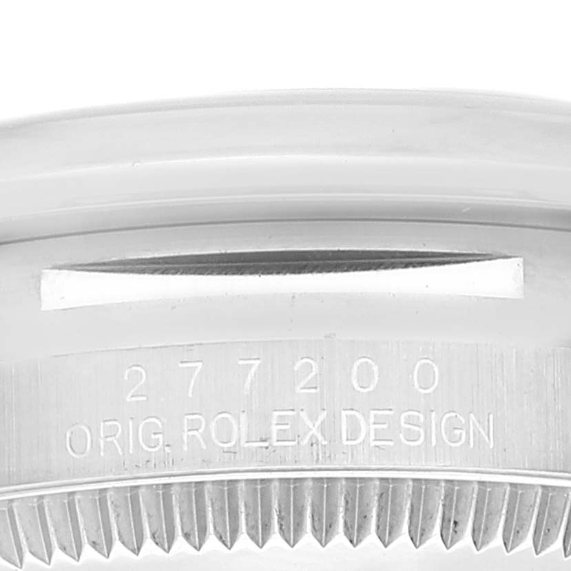 This close-up image shows the bezel and case side of a Mid-Size Rolex watch, displaying the model number and "ORIG. ROLEX DESIGN" engraving.