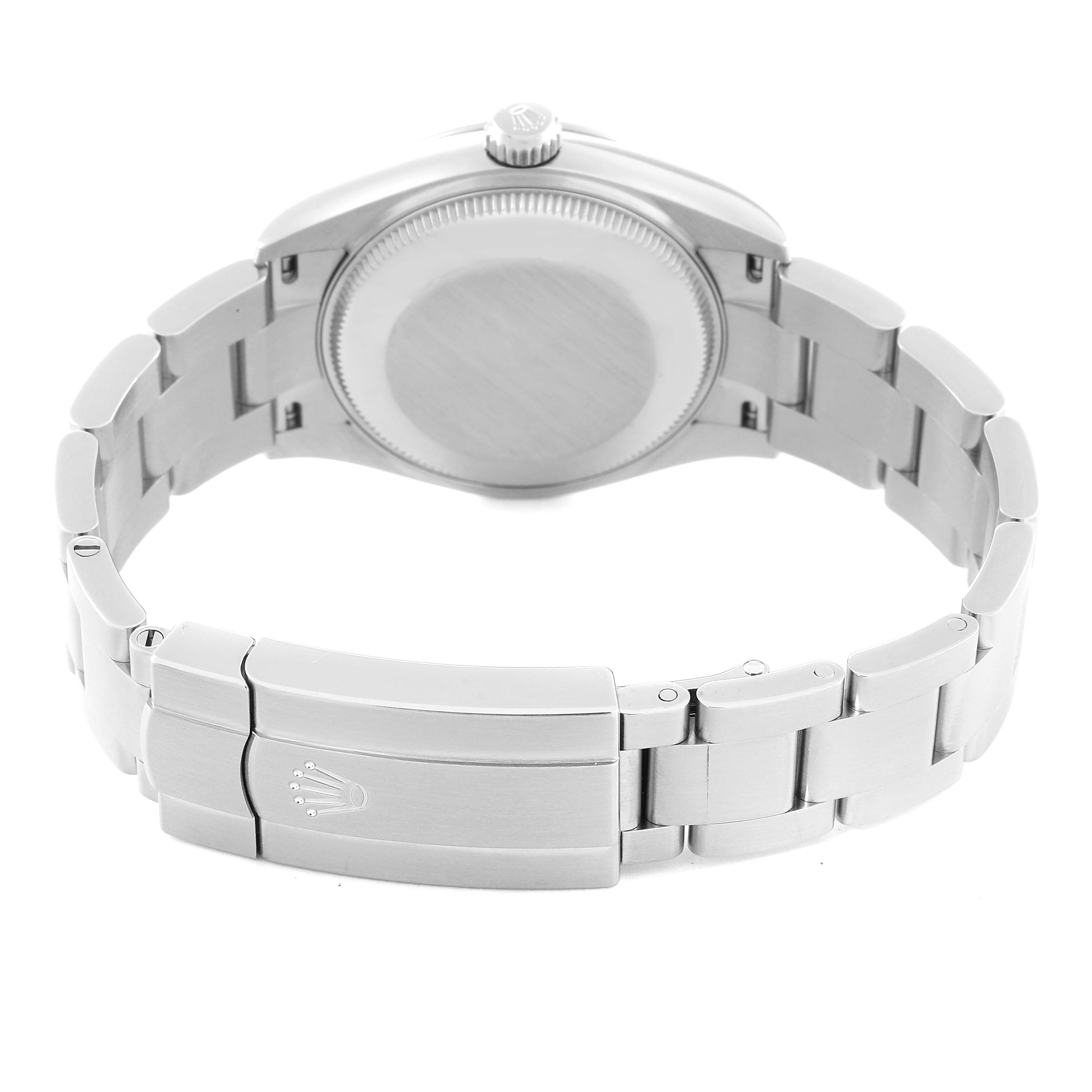 The image shows the underside of a Mid-Size Rolex watch, focusing on the case back and clasp of the bracelet.