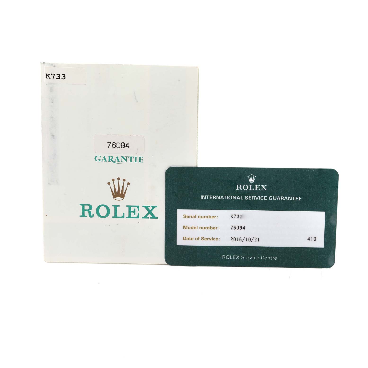 The image shows a Rolex Oyster Perpetual 76094 Women's Stainless Steel Black Dial 76094 Women's Stainless Steel Black Dial model's warranty card and associated documentation from an angle.